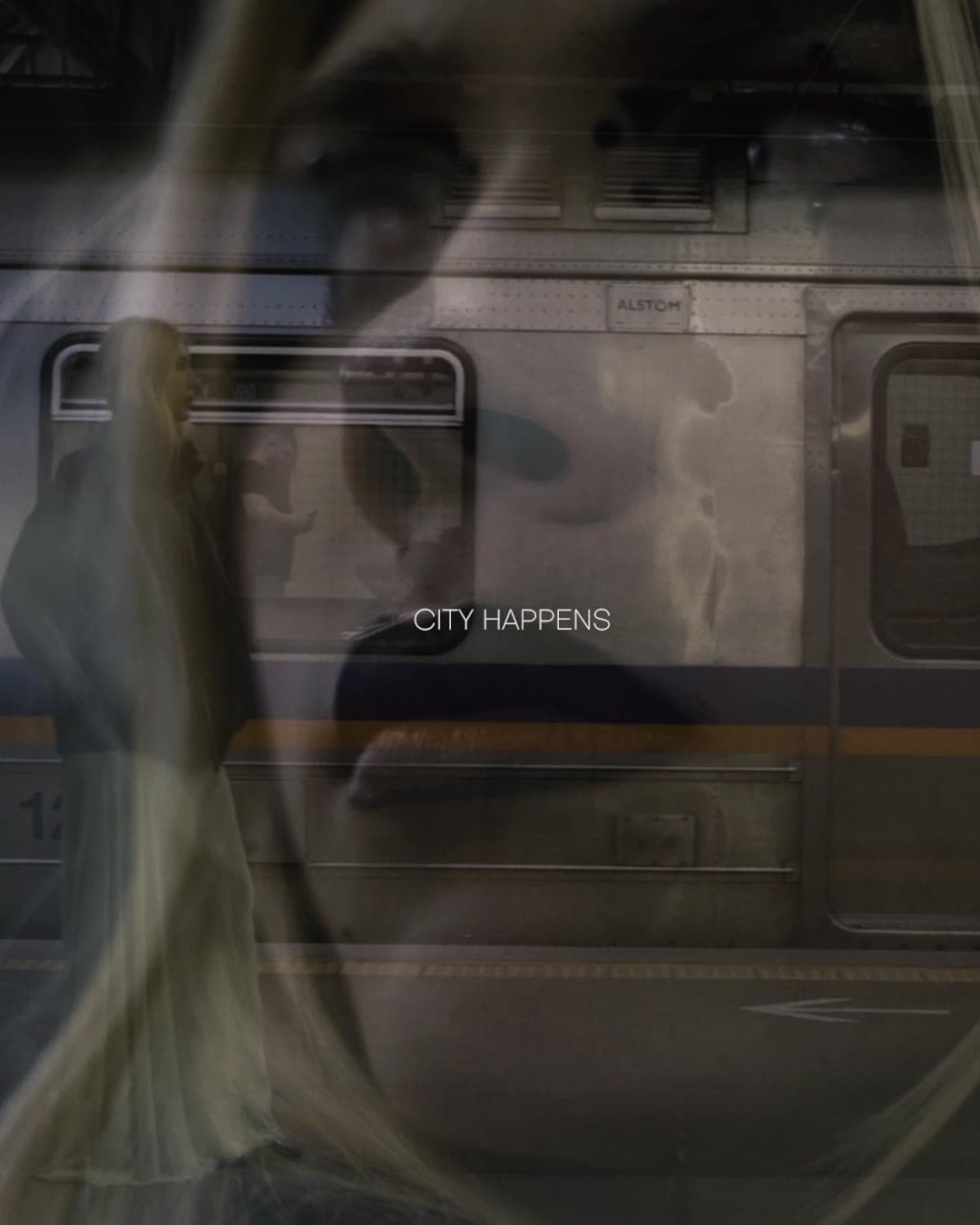 A short cut: a blurred figure in a pale gown passes a metro train, then a close-up of a woman with graphic black eye make-up.